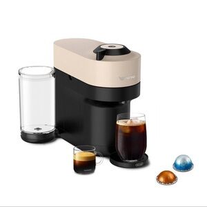 Nespresso Tan and Black Coffee Machine
